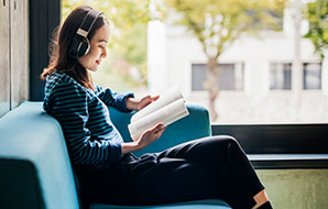 A women reading Courseware book